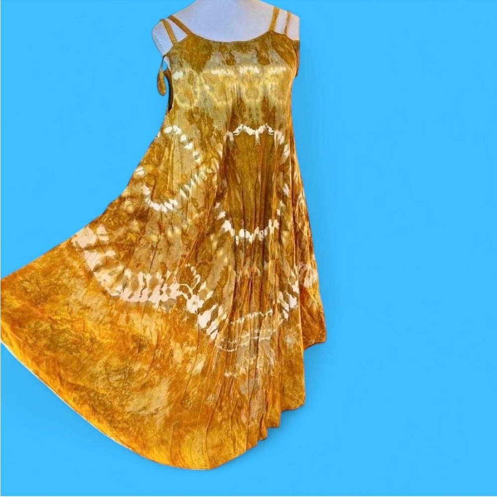 Golden yellow tie dye maxi dress with off the shoulder strap and rounded hem.